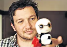  ??  ?? Out of this world: Ben Jarrod with a Kirobo robot, a version of which was on the ISS