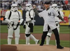  ?? JULIE JACOBSON — ASSOCIATED PRESS ?? Director Ron Howard throws out the first pitch May 4 in New York.