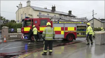  ??  ?? Greystones Fire Service dealing with the flooding incident on Sunday morning.