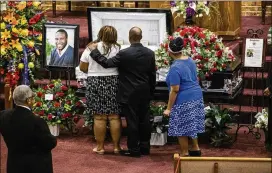  ?? SHABAN ATHUMAN / DALLAS MORNING NEWS ?? Mourners console each other during the public viewing before the funeral of Botham Jean on Thursday in Richardson. He was shot and killed by a Dallas police officer in his apartment last week.