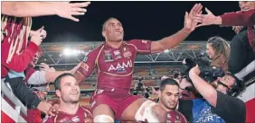  ?? Photo: GETTY IMAGES ?? Plaudits: We won – and Petero Civoniceva is carried from the field after his last game for the Maroons.