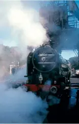  ?? ?? A2 Pacific No. 60532 lets off steam after having its tender refilled at the coal hopper at Grosmont on the North Yorkshire Moors Railway on October 6, 2000. ROBIN JONES