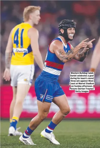  ?? ?? Western Bulldog Caleb Daniel celebrates a goal during his team’s round three win against West Coast at Marvel Stadium on Sunday afternoon. Picture: Darrian Traynor/ Getty Images