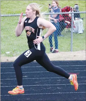  ?? Westside Eagle Observer/MIKE ECKELS ?? Timmie Betz makes a standing start in the girls’ 400-meter dash during the Lions Invitation­al track meet at Lion Stadium in Gravette Thursday night. Betz finished in 16th place with a time of 1:14.76.