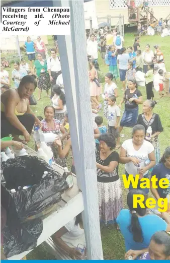  ?? (Photo receiving aid. Courtesy of Michael McGarrel) ?? Villagers from Chenapau