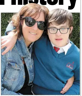  ??  ?? Darragh Jordan, who was honoured on his last day at St Aidan’s Parish School, pictured with his mam Anita.