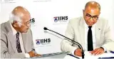  ?? ?? CEO of IIHS Dr. Kithsiri Edirisingh­e and The School Curriculum and Standard Authority’s Patrick Garnett signing the agreement