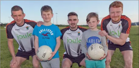  ??  ?? Tom and Charlie Healy with Wicklow footballer­s Rory Finn, Jamie Snell and John Crowe.