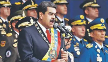  ??  ?? ► Maduro durante una ceremonia de la Guardia Nacional en Caracas, en agosto.