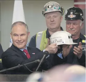  ?? JUSTIN MERRIMAN/GETTY IMAGES ?? U.S. Environmen­tal Protection Agency Administra­tor Scott Pruitt, pictured in April after speaking with coal miners in Pennsylvan­ia, said Monday he will sign a new rule overriding the Clean Power Plan, an Obama-era effort to limit carbon emissions from...