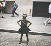  ?? VICTOR J. BLUE / BLOOMBERG FILES ?? The Fearless Girl statue was commission­ed as part of a campaign urging corporate boards to add more women.