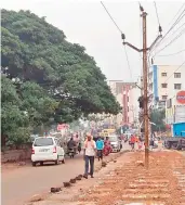  ??  ?? An electric pole prevents smooth flow of traffic on Shaikpet-Narsingi road.