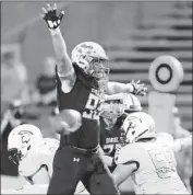  ?? Charles Bernhardt All-League Sports Photos ?? MISSION VIEJO defensive end Lance Keneley has 10 sacks this season for the unbeaten Diablos.