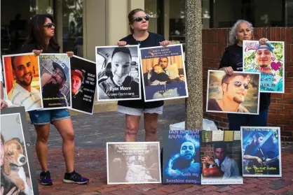  ?? Photograph: Nic Antaya/Boston Globe via Getty Images ?? Protesters earlier in August outside court in Boston. Massachuse­tts is among several states that have brought civil lawsuits against Purdue and others.