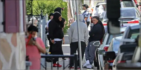  ?? STUART CAHILL / HERALD STAFF ?? OFFICER WAKE-UP CALL: The scene of a fatal officer-related shooting and stabbing on Glendale Street in Dorchester yesterday, an event neighbors say is uncharacte­ristic of the area