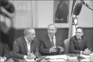  ?? AP/DAN BALILTY ?? Israeli Prime Minister Benjamin Netanyahu (center) chairs the weekly Cabinet meeting Sunday in Jerusalem.