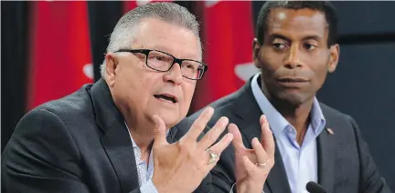  ?? JUSTIN TANG/THE CANADIAN PRESS ?? Liberal candidates Ralph Goodale, left, and Greg Fergus answer questions from reporters in Ottawa on Wednesday.