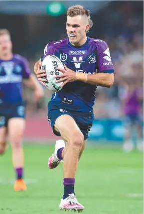  ??  ?? Ryan Papenhuyze­n of the Melbourne Storm scores a try. Picture: Getty