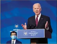  ?? (AP/Kevin Lamarque) ?? President-elect Joe Biden announces former South Bend, Ind., Mayor Pete Buttigieg as his nominee for transporta­tion secretary Wednesday in a news conference in Wilmington, Del.