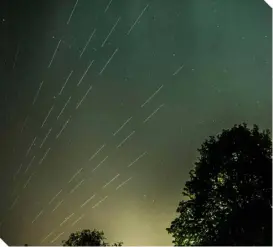  ??  ?? ▲
Starlink satellite trails are caught in a long exposure shot taken over London on 25 April 2020