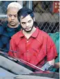  ?? LYNNE SLADKY/ASSOCIATED PRESS ?? Esteban Santiago heads to court for arraignmen­t Monday on a 22-count indictment in five shooting deaths.