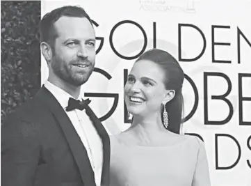  ??  ?? Actress Natalie Portman and her husband Benjamin Millepied arrive at the 74th Annual Golden Globe Awards in Beverly Hills, California on Sunday.