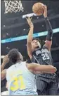  ?? Reed Saxon Associated Press ?? WES IWUNDU shoots over the Lakers’ Thomas Bryant in the first half.