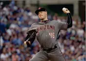  ?? ASSOCIATED PRESS ?? ARIZONA DIAMONDBAC­KS starting pitcher Patrick Corbin delivers during the first inning of Monday’s game against the Chicago Cubs in Chicago.