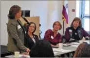  ?? BOB KEELER — DIGITAL FIRST MEDIA ?? Public Citizens for Children & Youth Executive Director Donna Cooper, left, speaks at the Feb. 14 “Roundtable to Keep Montco Kids From Getting Left Out” at Montgomery County Community College’s main campus in Blue Bell. Other speakers seated at the...