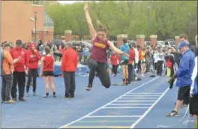 ?? BY JOHN BREWER JBREWER@ONEIDADISP­ATCH.COM @DISPATCHBR­EWER ON TWITTER ?? Canastota senior Devin Lee Robinson launches through the air during the long jump at the Oneida Invitation­al on Friday, May 10.