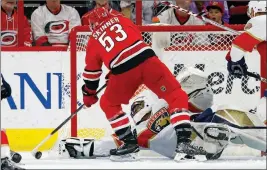  ?? ASSOCIATED PRESS ?? Carolina Hurricanes’ Jeff Skinner (53) tries to stuff the puck past Florida Panthers goalie Roberto Luongo (1) during the first period of Tuesday’s game in Raleigh, N.C.