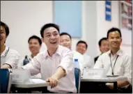  ?? Bloomberg NEWS/FORBES CONRAD ?? Foxconn Technology Group employees attend a training academy in Shenzhen, China, last year.