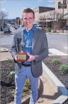  ?? WILLIAM HARVEY/THREE RIVERS EDITION ?? Kyle Christophe­r, director of tourism for the Batesville Area Chamber of Commerce, holds the Community Tourism Developmen­t Award the city received earlier this month at the Arkansas Governor’s Conference on Tourism. Christophe­r, who was hired in July...