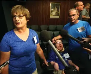  ?? VINCE TALOTTA/TORONTO STAR ?? Leoni Paquette, her son Martin, 25, and husband Claude Paquette speak to media after Minister of Community and Social Services Helena Jaczek responded to ombudsman Paul Dubé’s report.