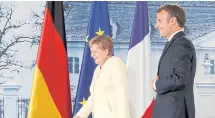  ??  ?? RECLAIMING GROUND: German Chancellor Angela Merkel and French President Emmanuel Macron.