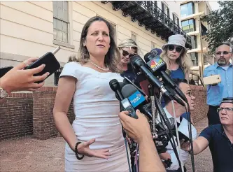  ?? LUIS ALONSO LUGO THE ASSOCIATED PRESS ?? Canadian Foreign Affairs Minister Chrystia Freeland talk to reporters outside the United States Trade Representa­tive building in Washington on Thursday.
