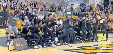  ?? Kennesaw State University ?? The Kennesaw State men’s basketball team reacts after seeing their name revealed during a watch party for the NCAA Tournament selection show Sunday at the KSU Convocatio­n Center.