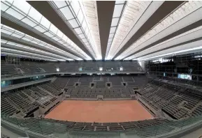  ?? (Reuters) ?? General view of the renovated Philippe-Chatrier central tennis court with its new retractabl­e roof composed of 11 wings at Roland-Garros in Paris, France, yesterday.