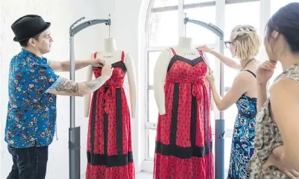  ?? EMILY BERL/THE WASHINGTON POST ?? Patrick Pettinato, left, Meredith Petro and Jackie Lee, all design and technical team members at ModCloth, test and measure two sizes of the same dress — a small and a 2X. The online retailer offers nearly three-quarters of its clothes in sizes XXS to...