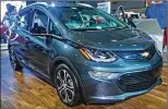  ?? CONTRIBUTE­D ?? GM believes its electric vehicles, such as the 2017 Chevy Bolt EV that can travel 238 miles on one charge, have largely solved the basic, daily use of EVs.