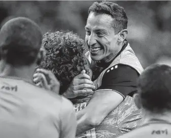  ?? Photos by Godofredo A Vásquez / Staff photograph­er ?? Mexico’s Andres Guardado, right, hugs keeper Guillermo Ochoa after Saturday’s shootout.