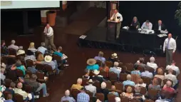  ??  ?? Bidders at Brian Lebel’s Cody Old West Auction in Santa Fe.