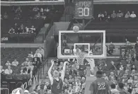  ?? JAY LAPRETE/AP ?? In this 2015 file photo, the shot clock is at 30 seconds as Walsh's Conor Keck shoots a free throw against Ohio State.