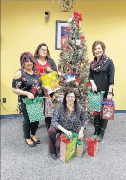  ?? SUBMITTED PHOTO ?? The NLCU in Labrador City supported the Labrador West Status of Women’s annual Sponsor a Mom Program, which provided support to a single mother over the holidays.