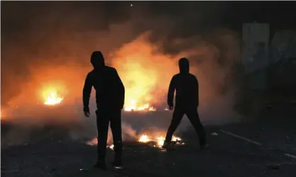  ?? Photograph: Peter Morrison/AP ?? Violence on Lanark Way in West Belfast on 7 April.