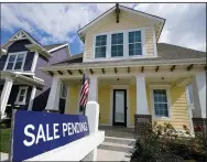  ?? (AP/Michael Conroy) ?? This “sale pending” sign sits in front of a home in Westfield, Ind. A gauge of U.S. pending home sales unexpected­ly declined in September for the first time in months.