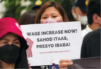  ?? (Mores Heramis/ABS-CBN News photo) ?? Members of different government employees associatio­ns held a protest outside the Department of Budget and Management in Mendiola, Manila last week, to call for the increase of minimum salaries for state workers.