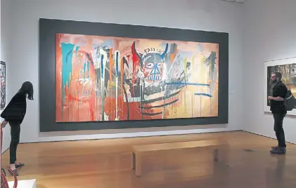  ?? AFP ?? Autorretra­to. “Sin título”, la obra de Basquiat por la que ayer pagaron 57,3 millones de dólares.