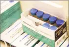  ?? Associated Press ?? Measles, mumps and rubella vaccines sit in a cooler at the Rockland County Health Department in Pomona, N.Y. In social media’s battle against misinforma­tion, bogus claims about the dangers of vaccines are the next target.