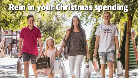  ?? 17. Picture: Simon Cross ?? BAGGING A BARGAIN: Well-prepared Christmas shopper Jo Wilson with daughter Evie, 6, flanked by sons Phoenix, 14, and Fynn,